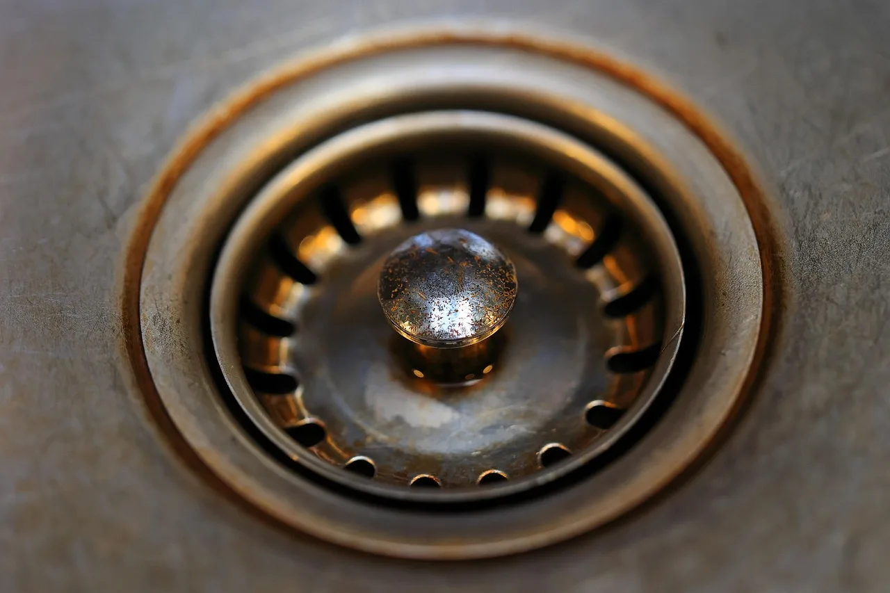 bathroom sink, metal, stole, drain, sieve, plug, rusty, dirty, old, drain, drain, drain, drain, drain. A Contractor's Guide to Drain Cleaning Contract Terms That Prevent Disputes