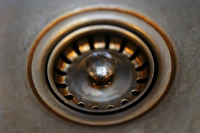 bathroom sink, metal, stole, drain, sieve, plug, rusty, dirty, old, drain, drain, drain, drain, drain. A Contractor's Guide to Drain Cleaning Contract Terms That Prevent Disputes