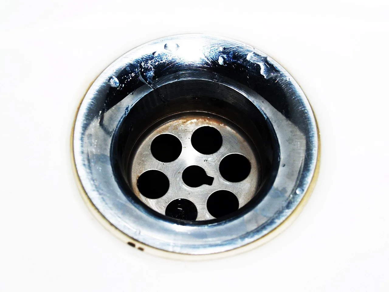 drain, cleaning, water, down, sink, steel, stainless, kitchen, household, home, squander, plug, hole, tableware, resources, closeup, pipe, dirty, nobody, discharge, plumbing, liquid, loss, sanitary, bright, head, circle, stream, jet, flush, abstract, flowing, fragment, drop, shiny, dishes, swirl, motion, washing, pour, house, cleanliness, running, domestic, concepts, metal. How the National Plumbing Code shapes drain work for Canadian contractors