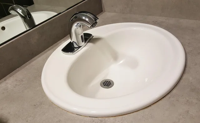 basin, sink, tap, drain, faucet, bathroom, bathroom sink, plumbing, bathroom interior, reflection, brown bathroom, brown interior, basin, sink, sink, sink, sink, sink, bathroom, bathroom, bathroom sink, plumbing, plumbing. Plumber insurance requirements for drain cleaning contractors
