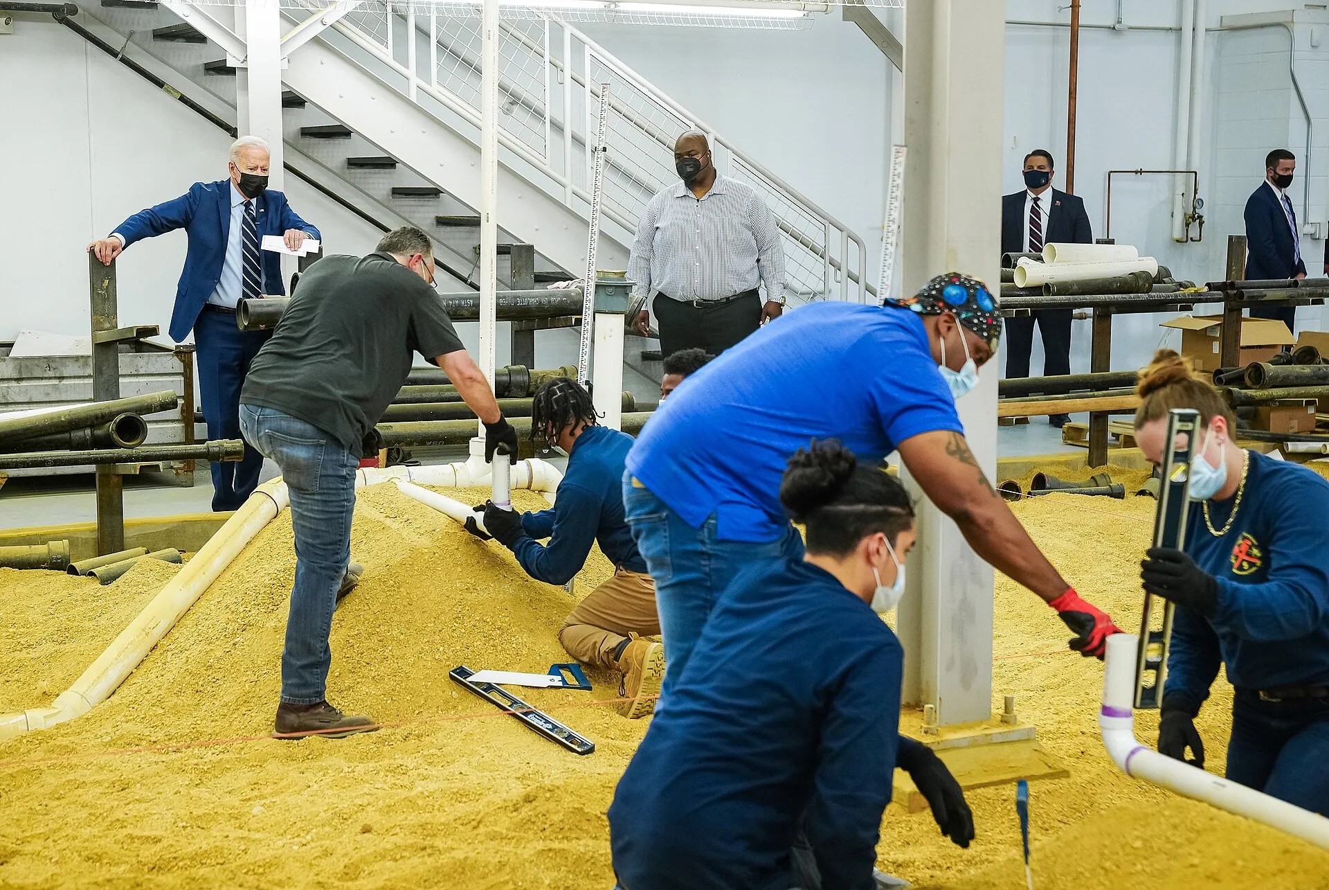 President Joe Biden observes trainers and apprentices at work at the sand training station during a tour of Plumbers & Gasfitters Local 5 Training Facility, Wednesday, Aug. 4, 2021, in Lanham, Maryland. (Official White House Photo by Adam Schultz). Plumbing contractor hiring and training guide