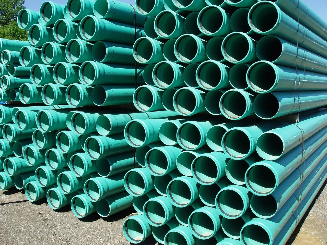 green, plastic, pipes, culvert, water, sewage, nature, pipe. Trenchless Sewer Repair Cost vs Traditional: What Drain Contractors Should Bid